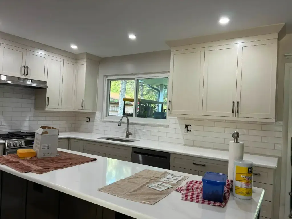 Kitchen with an island and a white subway tile backsplash under the cabinets